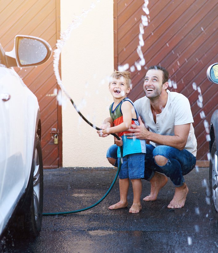 Man and Child Washing Car